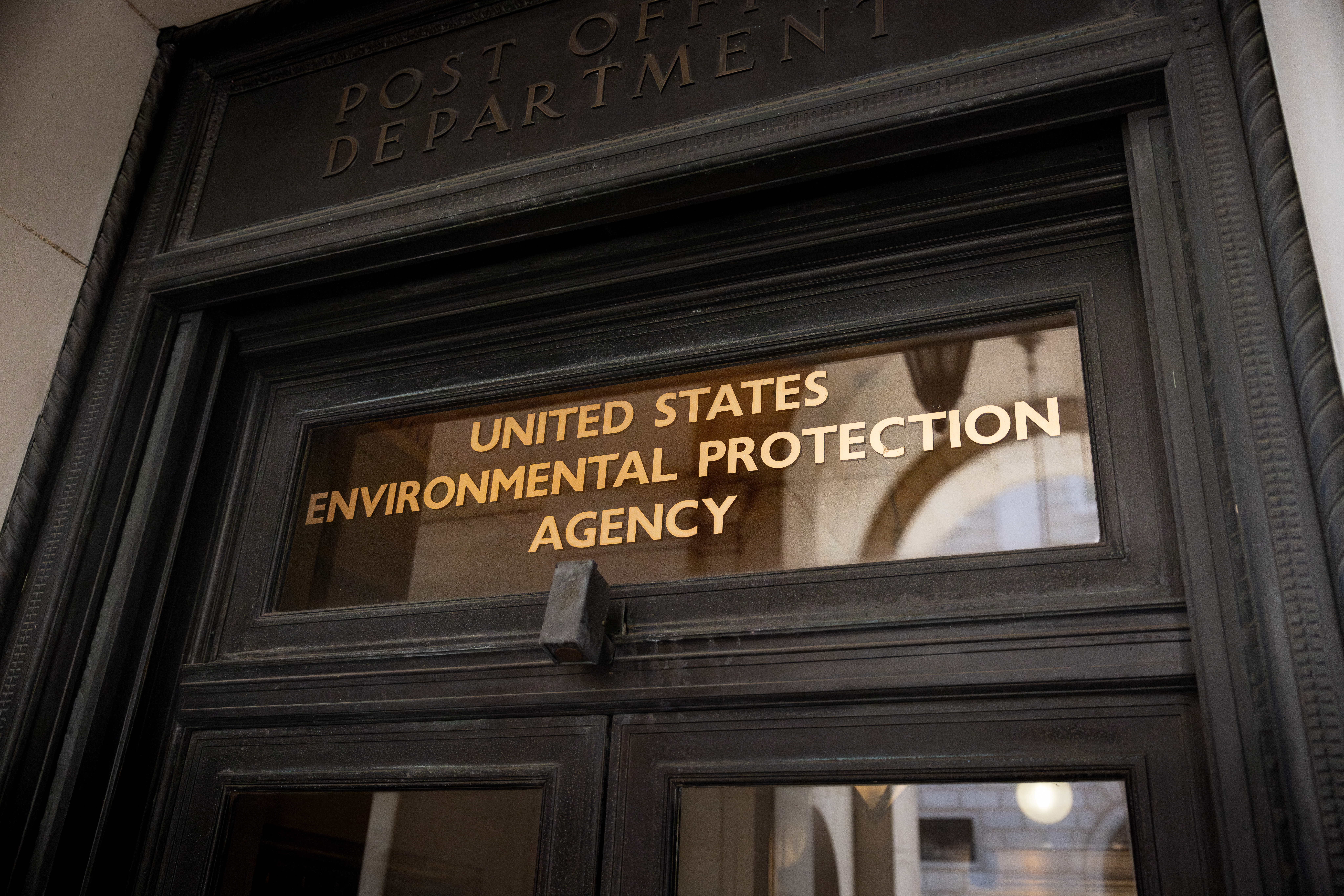 Words on a door's transom window reading "United States Environmental Protection Agency"