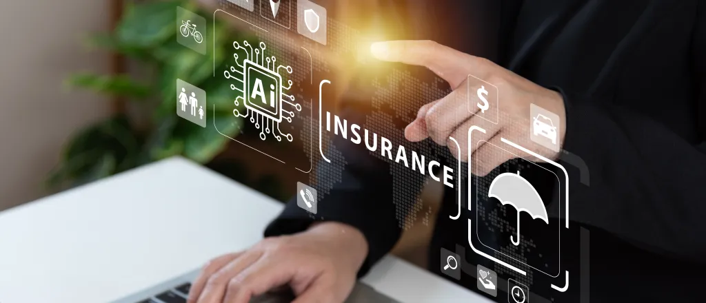 Insurance and technology © Poca Wander Stock - iStock-1470986827 Hands of a business professional near computer and holographic symbols - Poca Wander Stock - iStock-1470986827