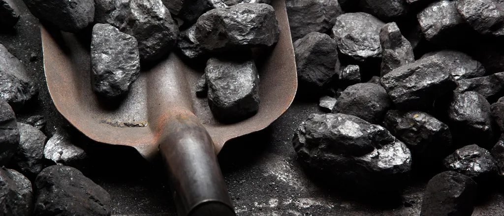 PROMO HIRES Energey - Coal Shovel Mine Minig - iStock - philip_hens Shovel containing and surrounded by pieces of coal