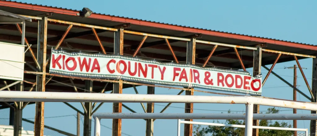 Grandstands at the Kiowa County fairgrounds in Eads, Colorado. Grandstands at the Kiowa County Fairground with a banner reading "Kiowa County Fair & Rodeo"