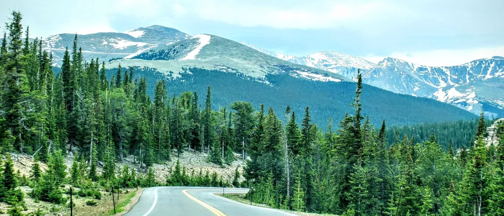 PROMO HIRES Outdoors - Mount Evans Mount Blue Sky Highway Road Mountain Trees - Rohan Bakshi - iStock-1150309753 Winding two lane road in the foreground with Mount Blue Sky (formerly Mount Evans) Colorado in the backgrount