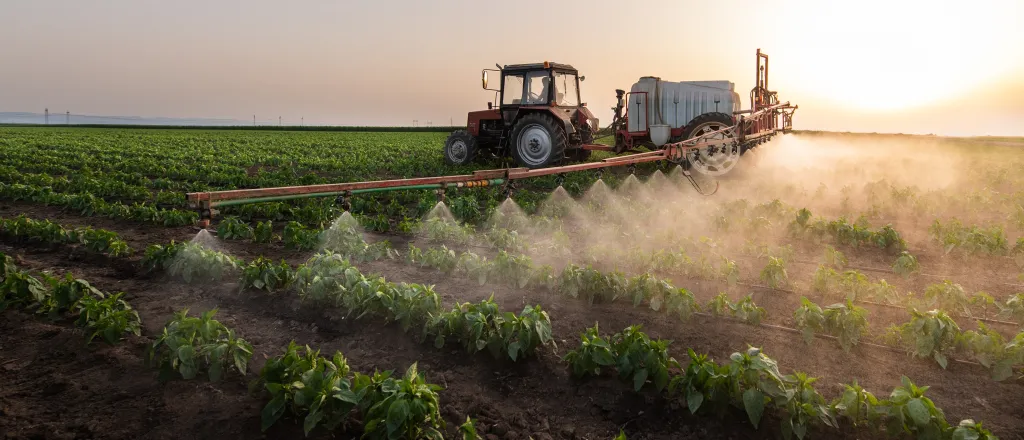 PROMO HIRES Agriculture - Spray Rig Field Crop Chemical - fotokostic - iStock-1324890919 Agricultural spray rig spreading a liquid chemical on a field.