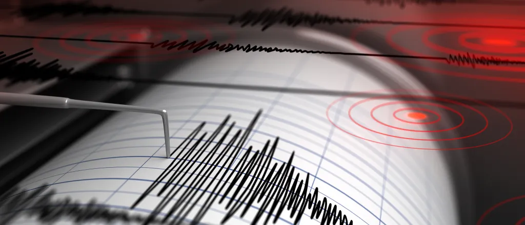 PROMO HIRES Miscellaneous - Earthquake Seismograph - iStock Earthquake seismograph drum with a stylus pen recording a large disturbance.