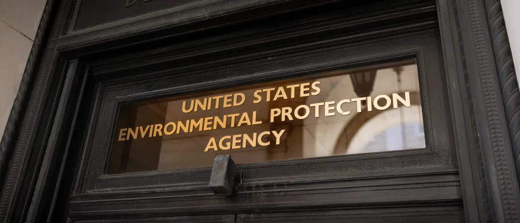 Words on a door's transom window reading "United States Environmental Protection Agency"