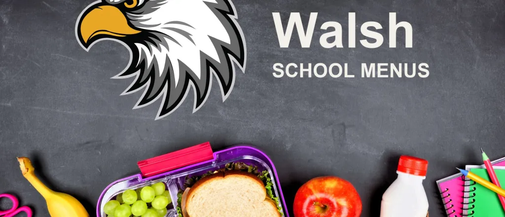 The Walsh School Eagles mascot, chalked on a blackboard above a packed school lunch of a sandwich, grapes, carrots, an apple and a bottle of milk, with pencils and notebooks. The board reads “Walsh School Menus”.