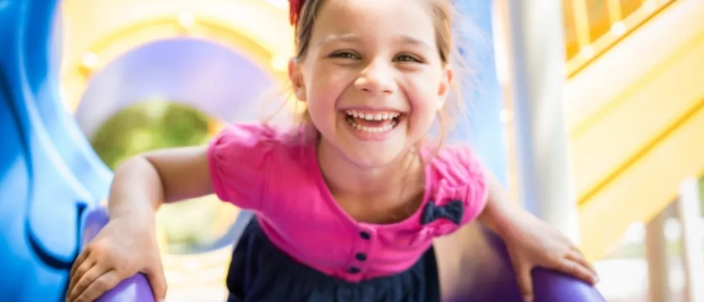 girl playing at best playgrounds in colorado