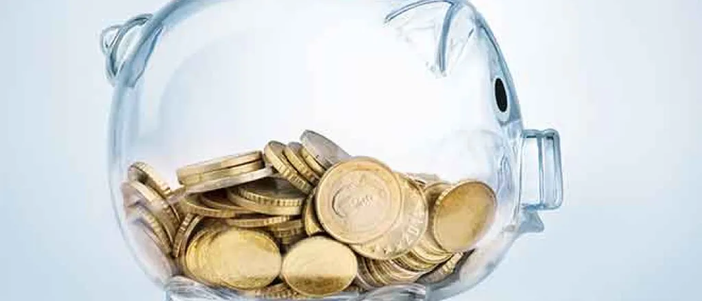 PROMO 64J1 Finance - Money Glass Piggy Bank with Coins - iStock - Pogonici PROMO Finance - Money Glass Piggy Bank with Coins - iStock - Pogonici