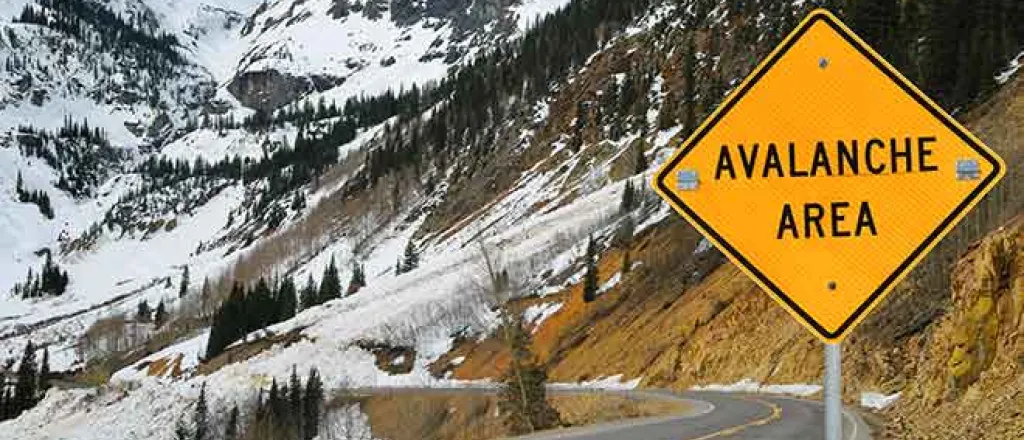PROMO 64J1 Miscellaneous - Avalanche Area sign snow mountain road danger emergency weather - iStock - wakr10 PROMO Miscellaneous - Avalanche Area sign snow mountain road danger emergency weather - iStock - wakr10