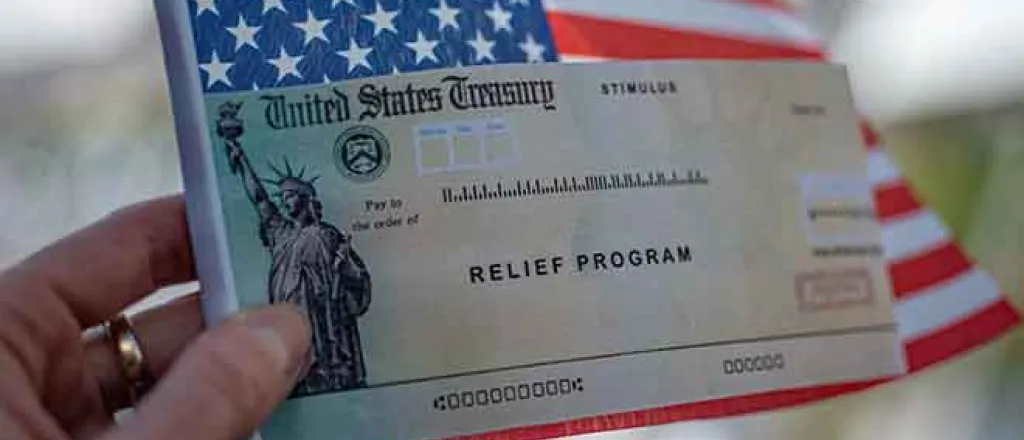 PROMO 64J1 Money - Relieve Program Check United States Flag Stimulus - iStock - Evgenia Parajanian PROMO Money - Relieve Program Check United States Flag Stimulus - iStock - Evgenia Parajanian