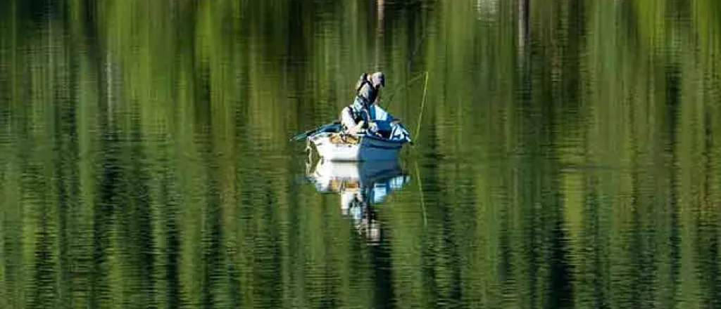PROMO 64J1 Outdoors - Boat Fishing Lake Trees Fisherman - iStock - Sparty1711 PROMO Outdoors - Boat Fishing Lake Trees Fisherman - iStock - Sparty1711