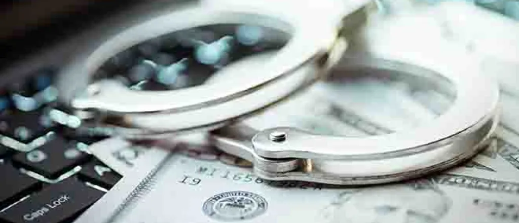 PROMO 64J1 Technology - Cyber Crime Handcuffs Money Computer Keyboard - iStock - turk_stock_photographer PROMO 64J1 Technology - Cyber Crime Handcuffs Money Computer Keyboard - iStock - turk_stock_photographer