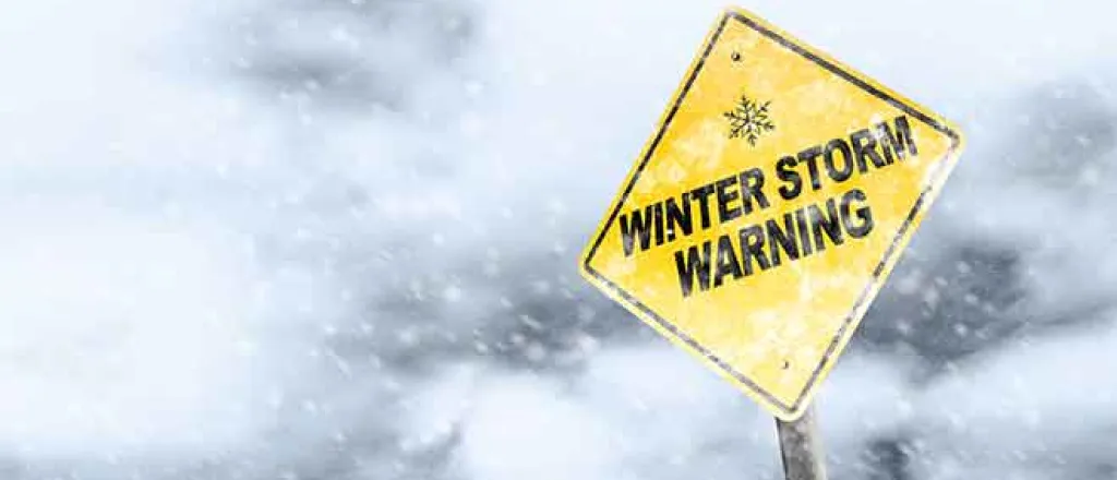 PROMO 64J1 Weather - Sign Winter Storm Warning Snow Ice - iStock - ronniechua PROMO Weather - Sign Winter Storm Warning Snow Ice - iStock - ronniechua
