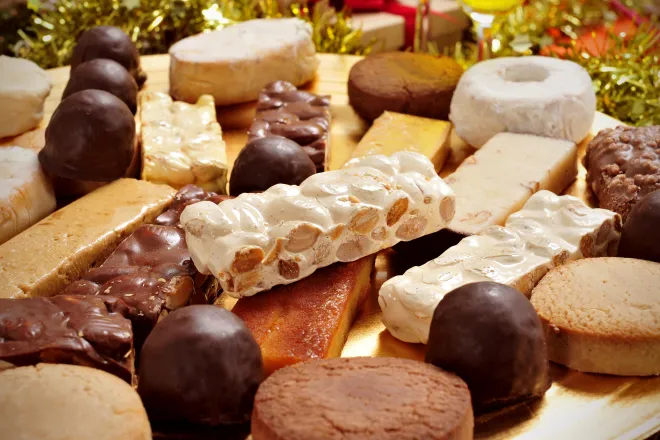 Stacks of assorted chocolates and other sweet confectioneries.