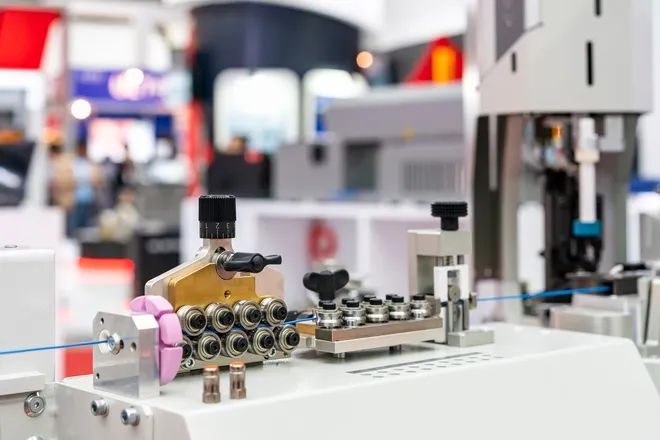 A metal roller guide feeder module device for automatic wire cable stripping and crimping in a workshop.