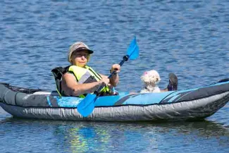 PICT 64J1 Woman in inflatable paddle boat - CPW PICT Woman in inflatable paddle boat - CPW