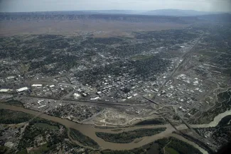 PICT The Colorado River flows through Grand Junction, June 9, 2023. The railroad is visible coming into the city from the left along the river then turning abruptly east. William Woody for Colorado Newsline PICT The Colorado River flows through Grand Junction, June 9, 2023. The railroad is visible coming into the city from the left along the river then turning abruptly east. William Woody for Colorado Newsline