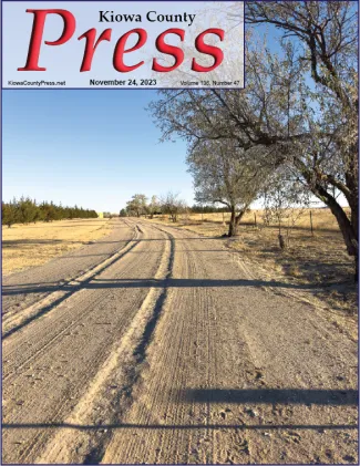 Photo of the week - 2021-11-24 - Gravel road in Kiowa County - Chris Sorensen. Front cover of the Kiowa County Press from November 24, 2023, showing a gravel road curving into the distance.