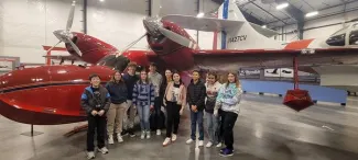 Plainview students and staff visiting the World War II Aviation Museum in Colorado Springs. Students and teachers standing near historic aircraft.