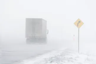 Semi truck on a snow-covered road