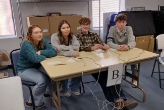 Plainview students at a Knowledge Meet in Eads, Colorado. Students seated at a table.