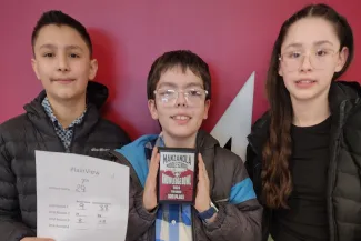 Plainview School students holding awards.