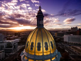 PROMO HIRES Government - Colorado Capitol Building Dome Sky Clouds - iStock - nick1803 Aerial view of the Colorado capitol building dome with clouds at sunset.