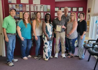 Members of the Kiowa County Department of Social Services receiving a performance award. Members of the Kiowa County Department of Social Services receiving a performance award.