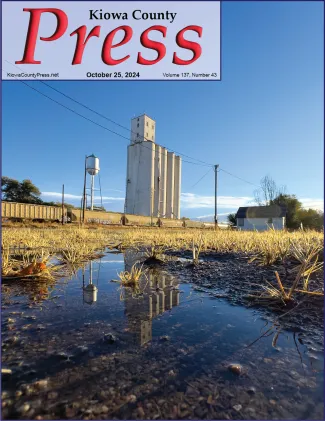 Grain elevator in Eads reflected in a rare puddle of rain water. - Chris Sorensen. Grain elevator in Eads reflected in a rare puddle of rain water. - Chris Sorensen.
