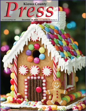 Photo of the week from the December 20, 2024, edition of the Kiowa County Press in Eads, Colorado - Merry Christmas from the Kiowa County Press - @RuthBlack. Close up of a gingerbread house decorated with assorted candies.