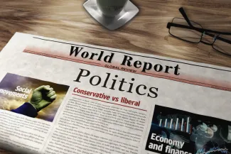 PROMO HIRES Media - News Newspaper Politics Government - Arkadiusz Warguła - iStock-1890683226 Front page of a newspaper with a headline reading "Politics" next to a pair of glasses.