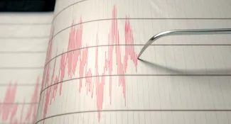 PROMO HIRES Miscellaneous - Earthquake Seismograph - iStock - allanswart Earthquake seismograph paper with a stylus pen recording large activity variations.