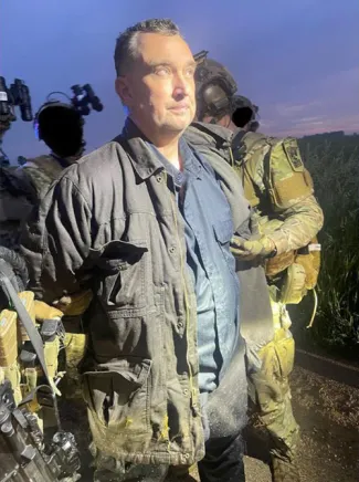 Vance Boelter being arrested.