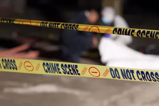 PROMO HIRES CROPPED Crime - Scene Tape Invesigation Law Enforcement Police Justice - Jacob Wackerhausen - iStock-2184583932 Close up of crime scene tape, which has the words "Do not cross," "No entry," and "Crime scene" printed in a repeating pattern.