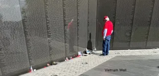 A person looking at the Vietnam War Memorial in Washington, D.C.