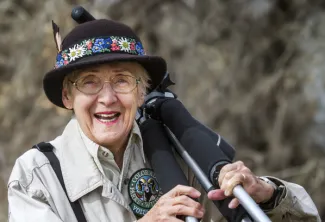 Older person in a Colorado Parks and Wildlife uniform representing agency volunteers