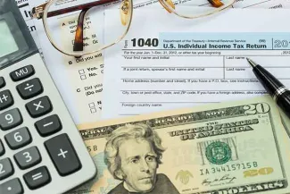 PROMO 64J1 Government - Tax Form Calculator Money - iStock PROMO Government - Tax Form Calculator Money - iStock