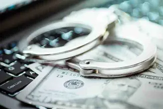 PROMO 64J1 Technology - Cyber Crime Handcuffs Money Computer Keyboard - iStock - turk_stock_photographer PROMO 64J1 Technology - Cyber Crime Handcuffs Money Computer Keyboard - iStock - turk_stock_photographer