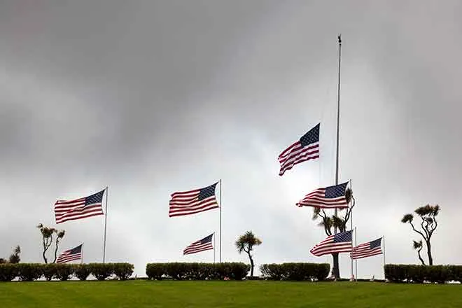 PROMO Memorial - Flags at Half Staff - iStock