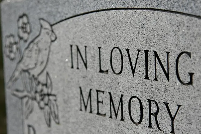 PROMO 660 x 440 Obituary - Grave Marker In Loving Memory - iStock