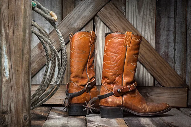 PROMO 660 x 440 Miscellaneous - Rodeo Boots Rope Barn Wood - iStock
