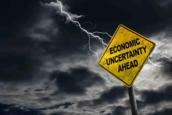 PROMO Economy - Sign Economic Uncertainty Ahead Inflation - iStock - ronniechua
