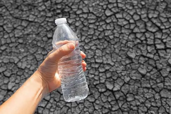 Miscellaneous - Drought Water Bottle Cracked Mud - iStock - kieferpix