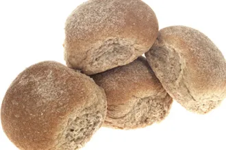 Feather Rolls Stack of four whole wheat rolls.