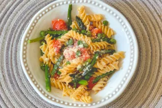Pasta Primavera Bowl of Pasta Primavera on a place mat.