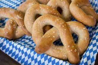 Several soft pretzel on a checkered cloth - USDA Several soft pretzel on a checkered cloth.