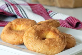 Homemade Bagels - USDA Serving plate of homemade bagels next to a cloth.