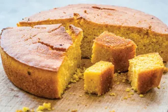 Lemon Corn Cake - USDA A lemon corn cake cut into various size pieces.