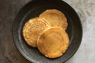 2025-02-08 RECIPE Cooking at Home - Whole Wheat Pancakes - USDA Overhead photo of a plate with three whole wheat pancakes
