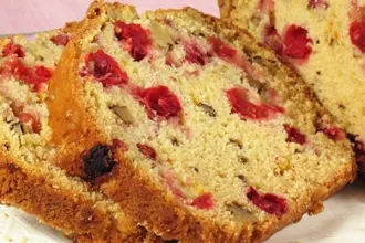 Close up view of two slices of cranberry nut bread
